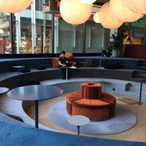 Carpeted amphitheater in an office space.