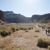 Hiking into an expansive canyon landscape