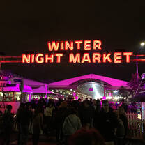 Neon sign saying, "Winter Night Market."