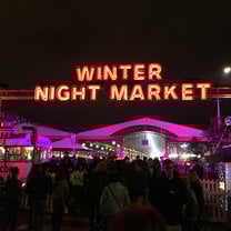 Neon sign saying, "Winter Night Market."