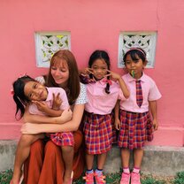 On Wednesdays we wear pink!  Picture of me and some of my kindergarten students
