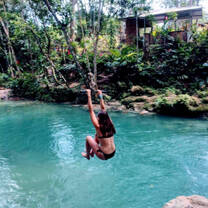 Volunteer on a rope swing