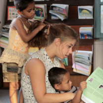 Volunteer reading to children
