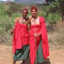 Volunteer and Kenyan man in traditional dress