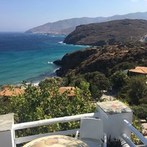 View from the cliffs looking down at a beach on Andros Island.