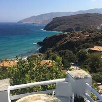 View from the cliffs looking down at a beach on Andros Island.