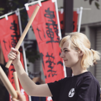 Performing with the Japanese drum club during a local festival