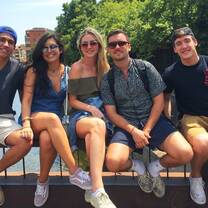 students sitting on a ledge posing for the camera in Costa Rica