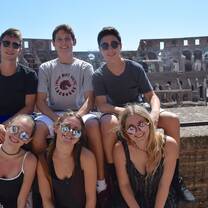 group in rome at the colosseum