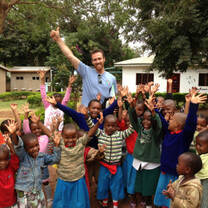 Volunteer teacher with children