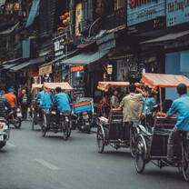 Rickshaws on road, Vietnam