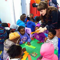 A volunteer with school children