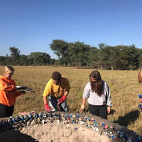 Working with eco-bricks re-using plastic bottles