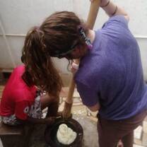 volunteer and host sister preparing local food