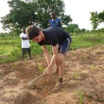 volunteer working on the community farm