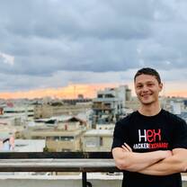 Man smiling on a rooftop in Tel Aviv.