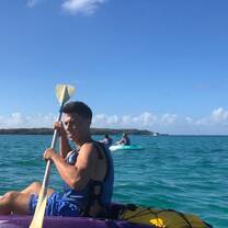 boy kayaking in hawaii