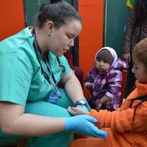 Medical volunteer with kid