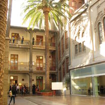 A university courtyard with palm trees