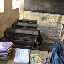 A classroom with the teachers desk in one of the schools on the project.
