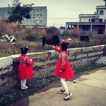 My two little girls dressed up for Chinese New Year. On the countryside visting family.