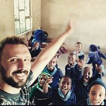 Teacher taken selfie picture with his class