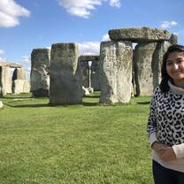 Student Gurjot Kang stands in front of Stonehenge.