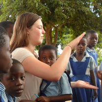 Volunteer given hi 5 to her  school kids