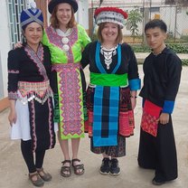 Those costumes are traditional Hmong costumes to celebrate the New Year. Some woman still sew those beautiful clothes by themselves. It takes them about half a year to a year, because there is a lot of complicated embroidery involved. 