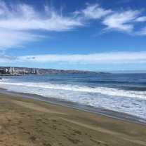 The beach at Vina del Mar, with a glimpse of the city skyline in the distance.