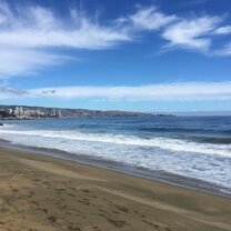 The beach at Vina del Mar, with a glimpse of the city skyline in the distance.