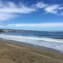 The beach at Vina del Mar, with a glimpse of the city skyline in the distance.