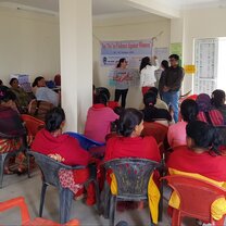 Volunteers teaching about domestic violence to a group of local women at a women's center Volunteers teaching about domestic violence to a group of local women at a women's center