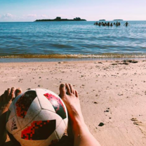 playing pick up soccer on the beach 