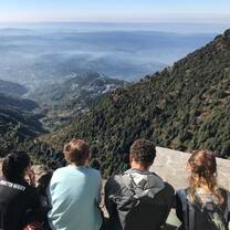 Participants resting after trekking up a hill