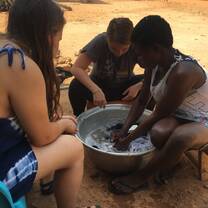 Our translator Jamila taking pity on us doing laundry alone :,)