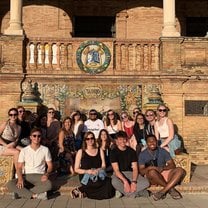 Students pose in front of the crest of Spain's provinces after taking a walking-guided tour. 