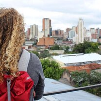 Volunteer looking out over a panoramic view of her city