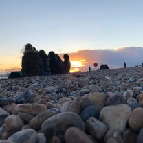 Nothing goes over a relaxing sunset at the seafront with friends