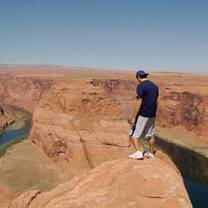Boy looking over river