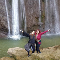 Me with another volunteer at a hideaway waterfall