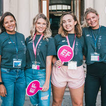 four staff members smiling 