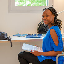 Absolute intern at her residence Absolute intern reading information about the Absolute Internship Program