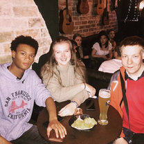 Three people sitting around a table