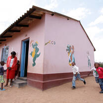Children running outside classroom
