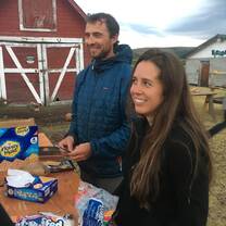 Gap students smile in front of red barn before the start of the Montana Roots Gap Program.