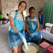 Volunteer supporting local business owner 