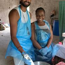 Volunteer supporting local business owner 