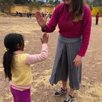 Volunteering with child in Peru