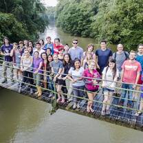 Class stops at Stone Bridge at La Selva for a photo